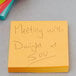 a yellow post-it note with writing on it