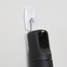 A black pen hanging on a white 3M Command Small Wire Hook.