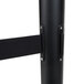 A black metal pole with dual black retractable belts.