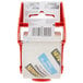 A roll of 3M Scotch heavy-duty packaging tape in a red dispenser with a bar code label.