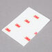 A white rectangular 3M Scotch clear mounting strip package with red and black text on it.