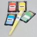 A 3M package containing yellow, blue, and white Post-It flags with a yellow highlighter.