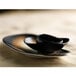 A close-up of a Tiger Organic porcelain tray with a black bowl and white bowl on it.