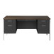 A walnut and black steel double pedestal desk with drawers on it.