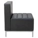 A black Alera armless chair with silver legs.