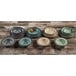 A group of Elite Global Solutions Cameo Blue mugs on a wood surface.
