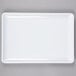 a white rectangular plate with a gray background