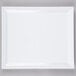 A white rectangular melamine serving platter with a white rim.