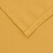 a close up of a yellow fabric