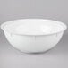 A white Fineline high profile plastic catering bowl with a lid on a gray background.