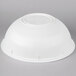A white plastic bowl on a gray background.