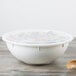 A white plastic Fineline catering bowl with a lid.