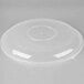 A close up of a clear plastic Fineline catering bowl lid with a round top.