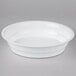 A white Fineline low profile plastic bowl with a lid on a white surface.