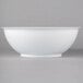 A white bowl with a white rim on a white background.