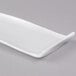 A white rectangular plate with a curved edge.