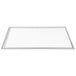 A white rectangular object with a silver frame.