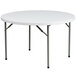 A Flash Furniture white round folding table with metal legs.