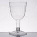 A Fineline clear plastic wine goblet with a stem.