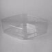 A clear plastic lid on a square container.