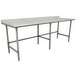 An Advance Tabco stainless steel work table with an open base and backsplash on legs.