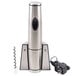 A stainless steel Waring wine bottle opener on a counter next to a bottle.