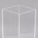 A clear plastic cube with a square base.