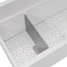 a white rectangular object with holes