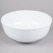 a white bowl on a gray surface