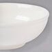 A white Thunder Group melamine pho noodle bowl with a white rim.