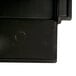 A black plastic panel with a circle in the middle.