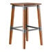 A Lancaster Table & Seating backless bar stool with a metal frame and rustic walnut finish.