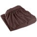 A brown folded Snap Drape table skirt on a white background.