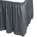 A slate blue Snap Drape table skirt with ruffles on it.