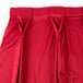 A red Snap Drape table skirt with pleats.