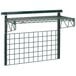 A Metro SmartWall G3 task station with green wire shelves and metal accessories.