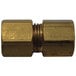 A close-up of a brass threaded male connector.