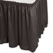 A charcoal Snap Drape table skirt on a table.