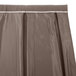 A gray table skirt with a white box pleat.