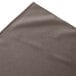 A gray Snap Drape box pleat table skirt with a folded edge.