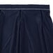 A navy Snap Drape table skirt with a pleated hem and Velcro clips.