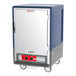 A blue Metro C5 heated holding cabinet with a solid door.