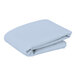 A folded light blue fabric table cover.