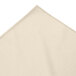 A cream Snap Drape table skirt on a table.