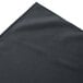 A slate blue Snap Drape box pleat table skirt folded up.