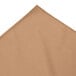 A Snap Drape sandalwood table skirt with bow tie pleats on a table.