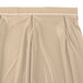 A cream Snap Drape table skirt with a pleated bow tie hem.