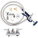 A T&S wall mount faucet with hose and spray valve.