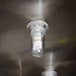 A FMP glass globe covering a ceiling light bulb.
