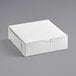 A white bakery box with a lid.